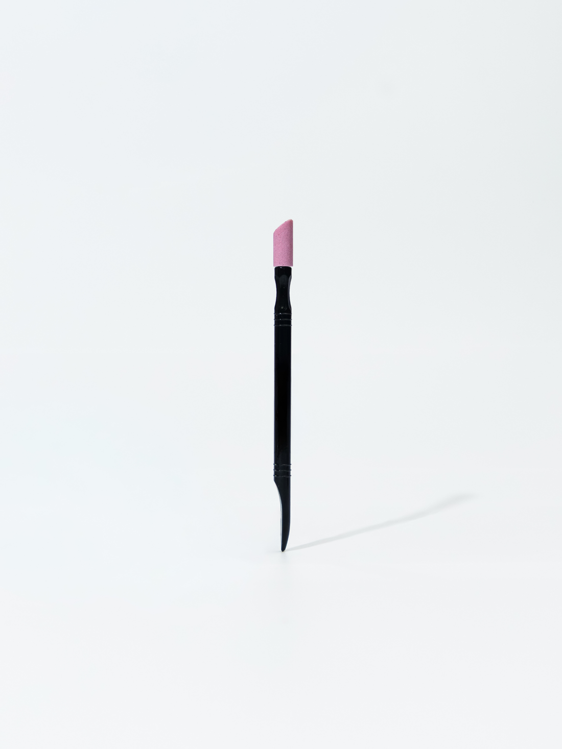 Plastic pusher with pumice stone for uncut manicure